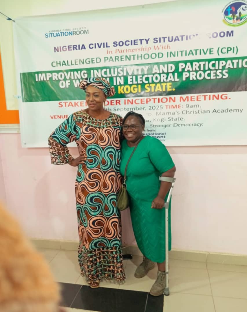 A photoshoot of 2 women, one of the women is a person with disability, charged to take active roles in Kogi electoral process and promote inclusivity
