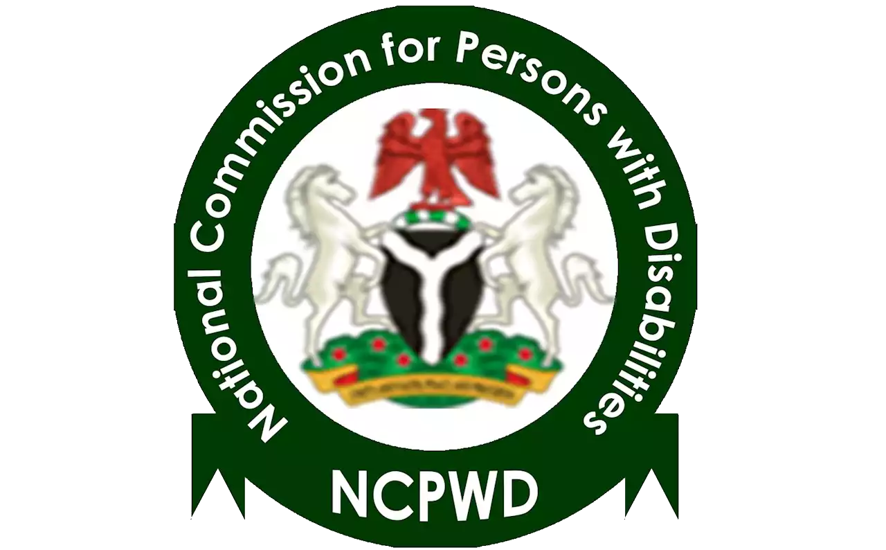 A green circular logo with the Nigerian coat of arms in the center. Around the coat of arms, there is a green band with the white text: "National Commission for Persons with Disabilities." At the bottom, within a green ribbon shape, the acronym "NCPWD" is written in bold white letters.